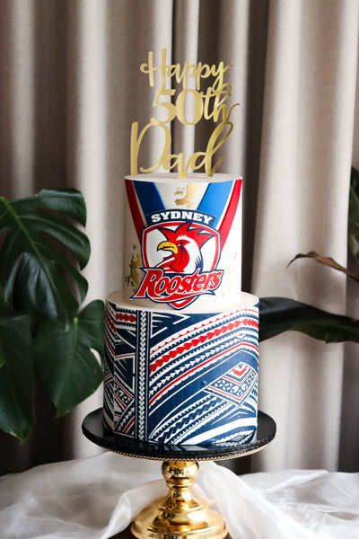 Two tier 50th birthday cake with a football team crest and hand-painted Polynesian pattern